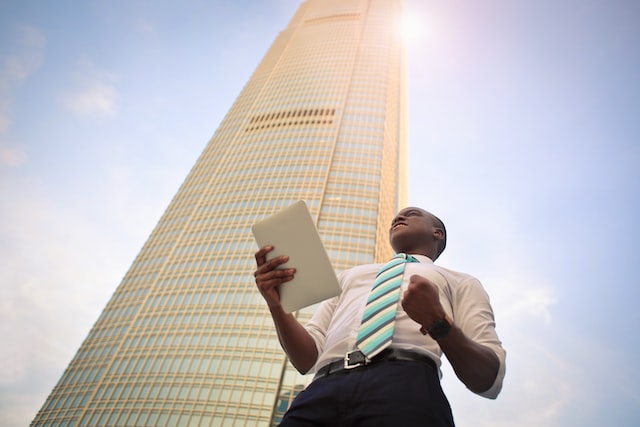 person standing near high building