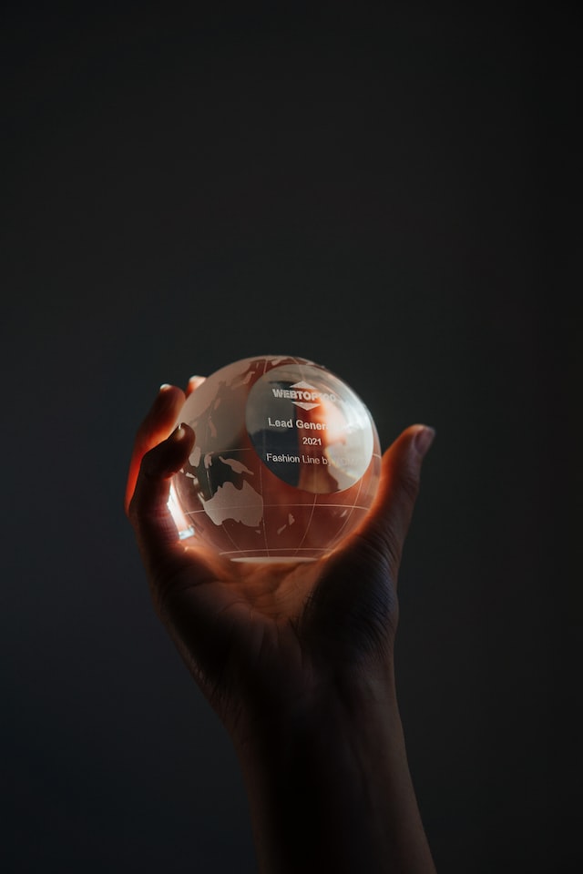 person holding rounded award