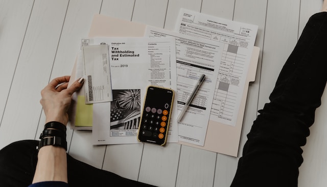 person holding finance documents