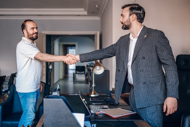 persons shaking hands